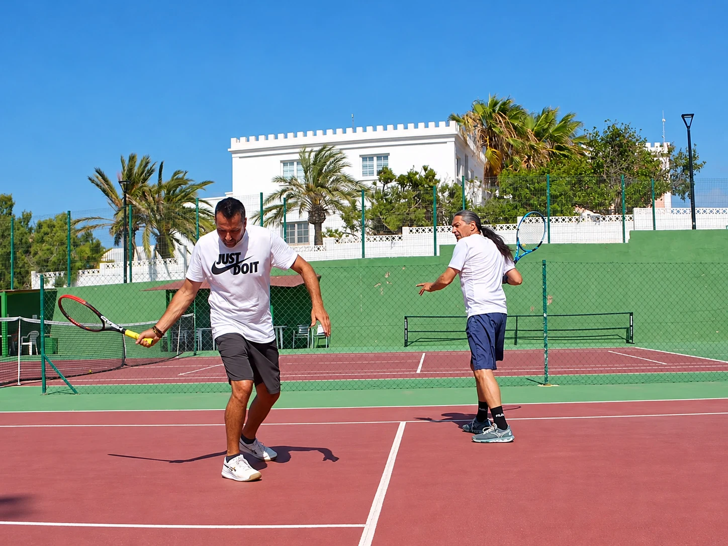 Pietro training with Francesco on court at Tennis Corralejo